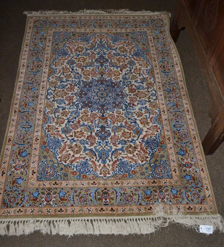 Lot 1167 - Isfahan rug, Central Iran, the ivory field of vines centred by a roundel enclosed by spandrels...