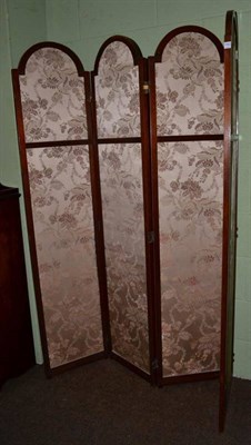 Lot 1180 - A mahogany four leaf dressing screen circa 1900, with floral patterned panels, each leaf...