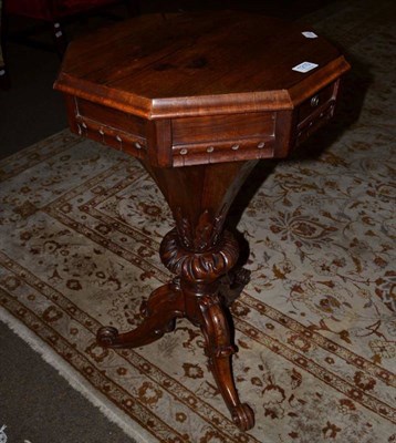 Lot 1210 - A Victorian rosewood sewing table, with octagonal hinged top on carved support and cabriole...
