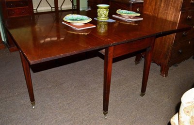 Lot 1215 - A large George III mahogany dropleaf table, 164cm wide