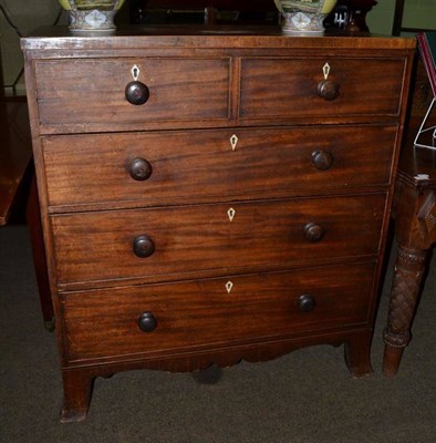 Lot 1218 - A George III mahogany five drawer straight fronted chest of drawers on splayed feet