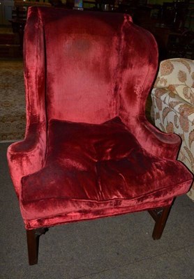 Lot 1220 - A George III style wing back armchair, 87cm wide