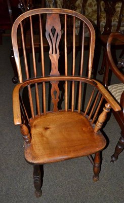 Lot 1222 - A 19th century ash Windsor double spindle back armchair