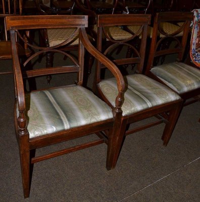 Lot 1224 - A set of seven late George III mahogany dining chairs with later upholstered drop in seats,...