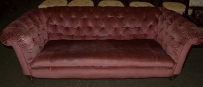 Lot 1229 - A Victorian Chesterfield sofa recovered in pink buttoned velvet, 200cm wide
