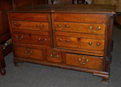 Lot 1246 - An 18th century oak mule chest adapted to a cupboard