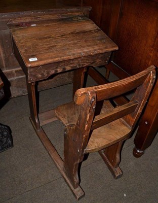 Lot 1250 - A Victorian pitch pine and elm school desk with sliding mechanism, by repute used by the artist...
