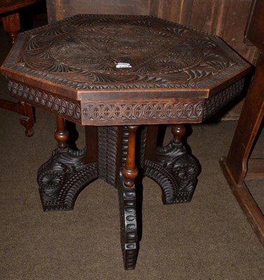 Lot 1251 - An Indian carved octagonal shaped centre table