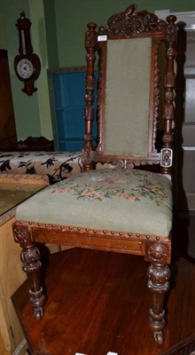 Lot 1254 - A Victorian carved mahogany nursing chair with woolwork floral upholstery