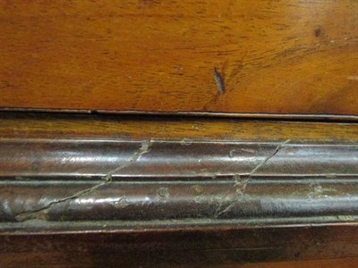 Lot 1261 - A George III mahogany linen press, the cupboard doors enclosing four siding trays