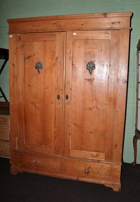 Lot 1264 - A 19th century Continental pine double door wardrobe, the interior with hanging space, the base...