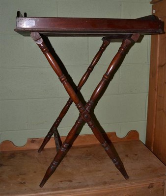 Lot 1266 - A Victorian mahogany butlers tray on spindle turned folding stand