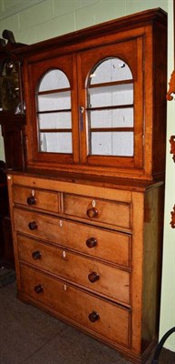 Lot 1279 - A mid 19th century kitchen cupboard on chest, the upper section with arched glazed doors, the...