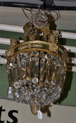 Lot 1286 - A gilt metal lustre drop ceiling light with artichoke pendant and lion mask decoration