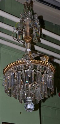 Lot 1287 - A pendant lustre drop light fitting with gilt metal and glass body