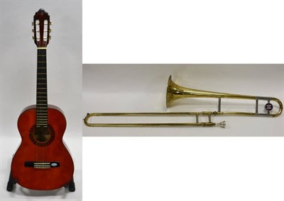 Lot 2029 - Guitar 3/4 size by Valencia, in Stagg hard case; together with a Trombone by MW, cased with...