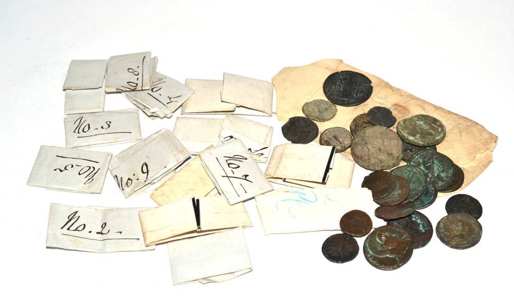Lot 5 - A quantity of Roman mainly bronze coins (39), a number wrapped in Victorian? paper and...