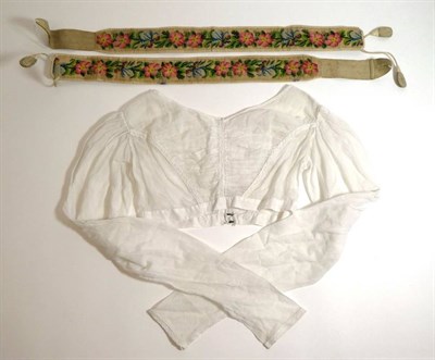 Lot 2058 - Circa 1830s White Muslin Spencer; Pair of Circa 1850s Gents Floral Embroidered Braces, worked...