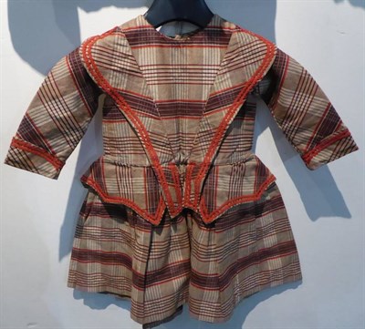 Lot 2059 - A Mid Victorian Childs Pleated Dress, in brown and red large check, with long sleeves, round...