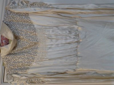 Lot 2066 - Assorted Early 20th Century Silk and Lace Wedding Gowns, comprising a long sleeved dress with...