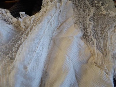 Lot 2077 - Early 20th Century Dresses, comprising a cream silk short sleeved wedding dress with floral...