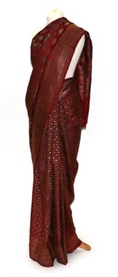 Lot 2152 - An Indian Red Silk Sari Woven with Gold Brocade, made by Rajwadi tailors