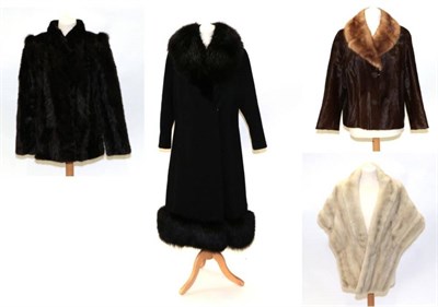 Lot 2193 - A Blin and Blin Black Wool Long Coat, with deep black fox fur collar and trimmed hem, fastened by a