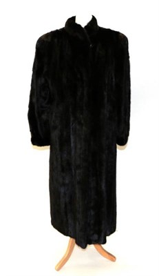 Lot 2194 - Whiteheads of Montpellier Harrogate Dark Brown Long Mink Coat, with side pockets, cuffed...