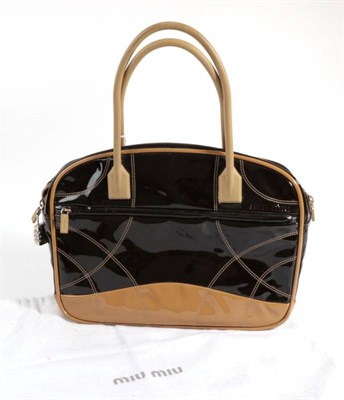 Lot 2225 - Miu Miu Brown Patent Leather Handbag, with tan trim and stiff resin handles, with attached...