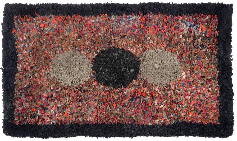 Lot 2231 - From the Estate of Hannah Hauxwell (1926-2018) A 20th Century 'Clippy' Rug, with three circles...