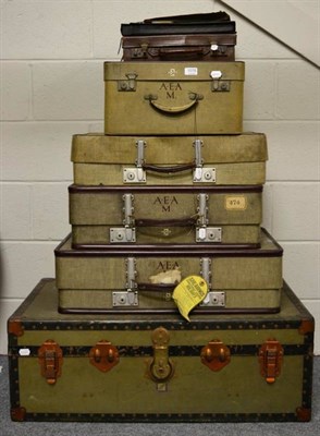 Lot 1078 - Various graduated canvas trunks (some monogrammed A.E.A.) and a further leather case also...