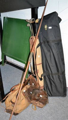 Lot 1080 - Two golf bags and clubs; a long bow and arrows; gun cleaning kit; two leather cartridge bags etc.