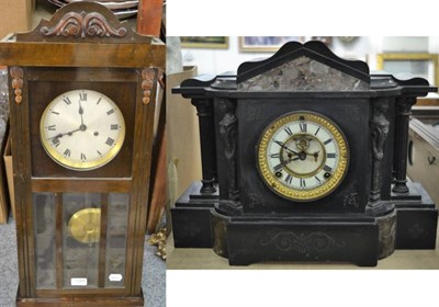 Lot 1088 - A late Victorian black slate mantel clock and a 1930s striking wall clock