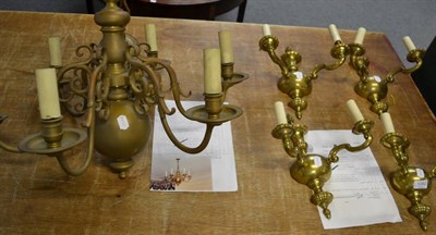 Lot 1092 - A six branch brass pendant light fitting; and a set of four brass two-branch wall lights