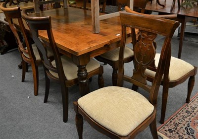 Lot 1117 - A modern oak dining table and six chairs