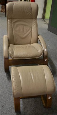 Lot 1131 - A modern leather upholstered bentwood rocking easy chair and matching footstool