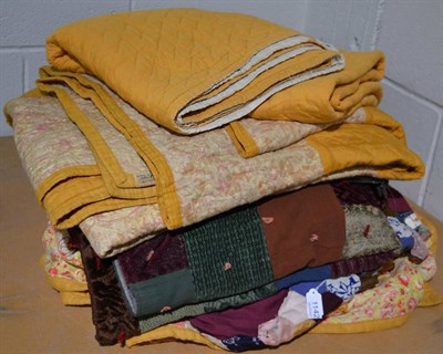 Lot 1142 - Circa 1930s mustard and paisley floral cotton quilt, the comfy with central diamond to front...