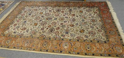 Lot 1162 - Tabriz carpet, Iranian Azerbaijan, circa 1950, the ivory field of palmettes and vines enclosed...
