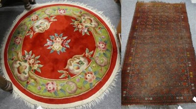 Lot 1166 - A Chinese circular rug, the crimson field of floral design, 128cm diameter together with an...