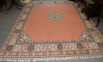 Lot 1171 - A Moroccan carpet, the salmon pink field with central medallion framed by spandrels and ivory...