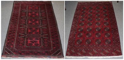 Lot 1175 - A Turkman rug, North Afghanistan, the madder field with four columns of octagons enclosed by...
