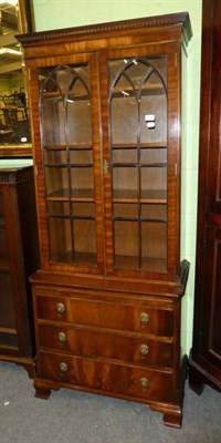 Lot 1190 - A reproduction glazed bookcase of small proportions