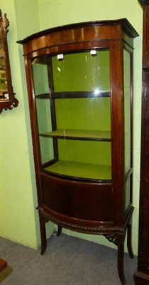 Lot 1194 - A bow fronted glazed mahogany display cabinet