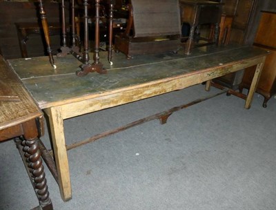 Lot 1199 - A stained pine farmhouse table