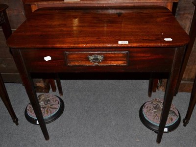 Lot 1203 - A mahogany side table with single small drawer on tapering square supports