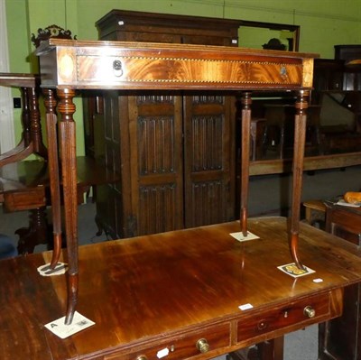 Lot 1210 - A reproduction inlaid mahogany leather topped writing table, fitted with a frieze drawer and raised