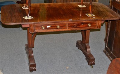 Lot 1211 - A mahogany sofa table fitted with two drawers