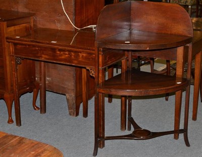 Lot 1212 - A mahogany fold over tea table; a two drawer side table and a mahogany corner washstand (3)