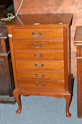 Lot 1213 - A music cabinet fitted with six drawers