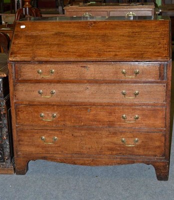 Lot 1215 - A 19th century oak bureau